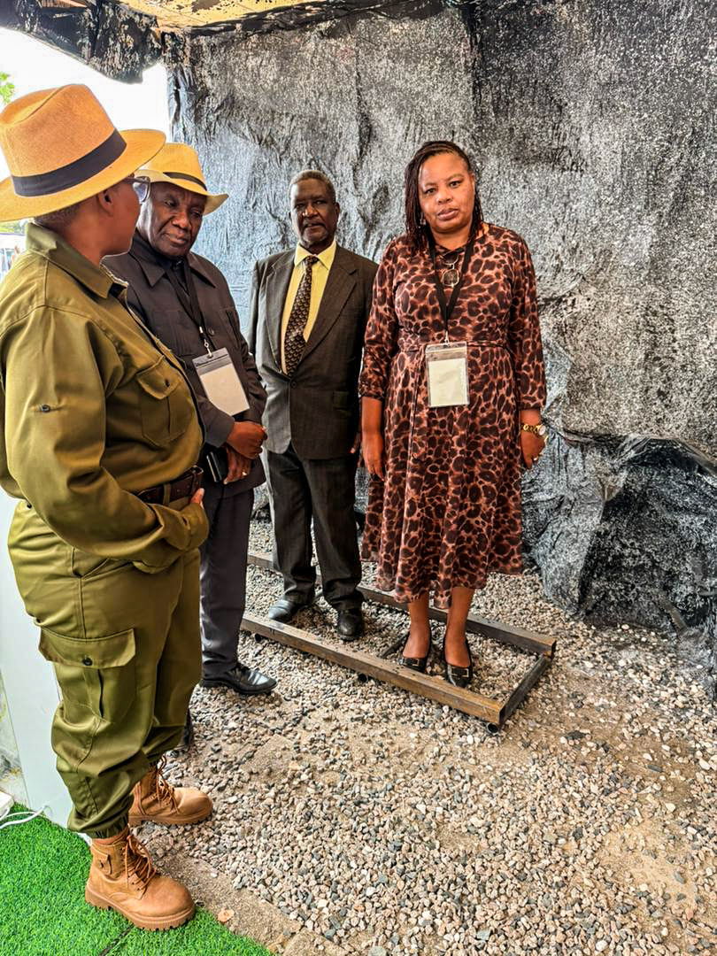 Visitors engaging with Veterans Mining Company representatives at the mining exhibition